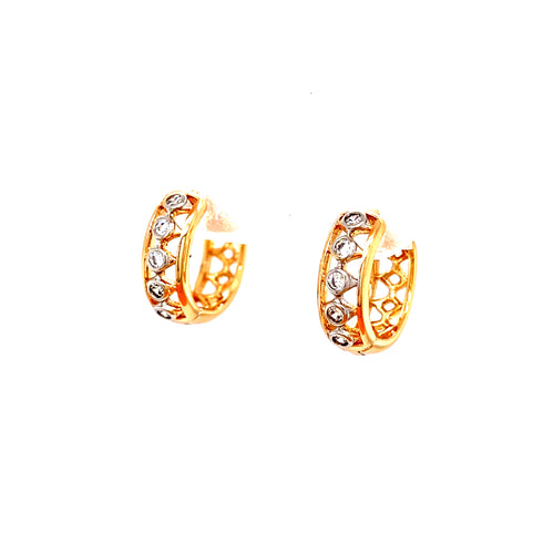 Close-up of the Tiny Zirconia Stones Huggies Earrings in rose gold fill, showcased against a white background. These hypoallergenic earrings feature a delicate openwork design on their inner side.